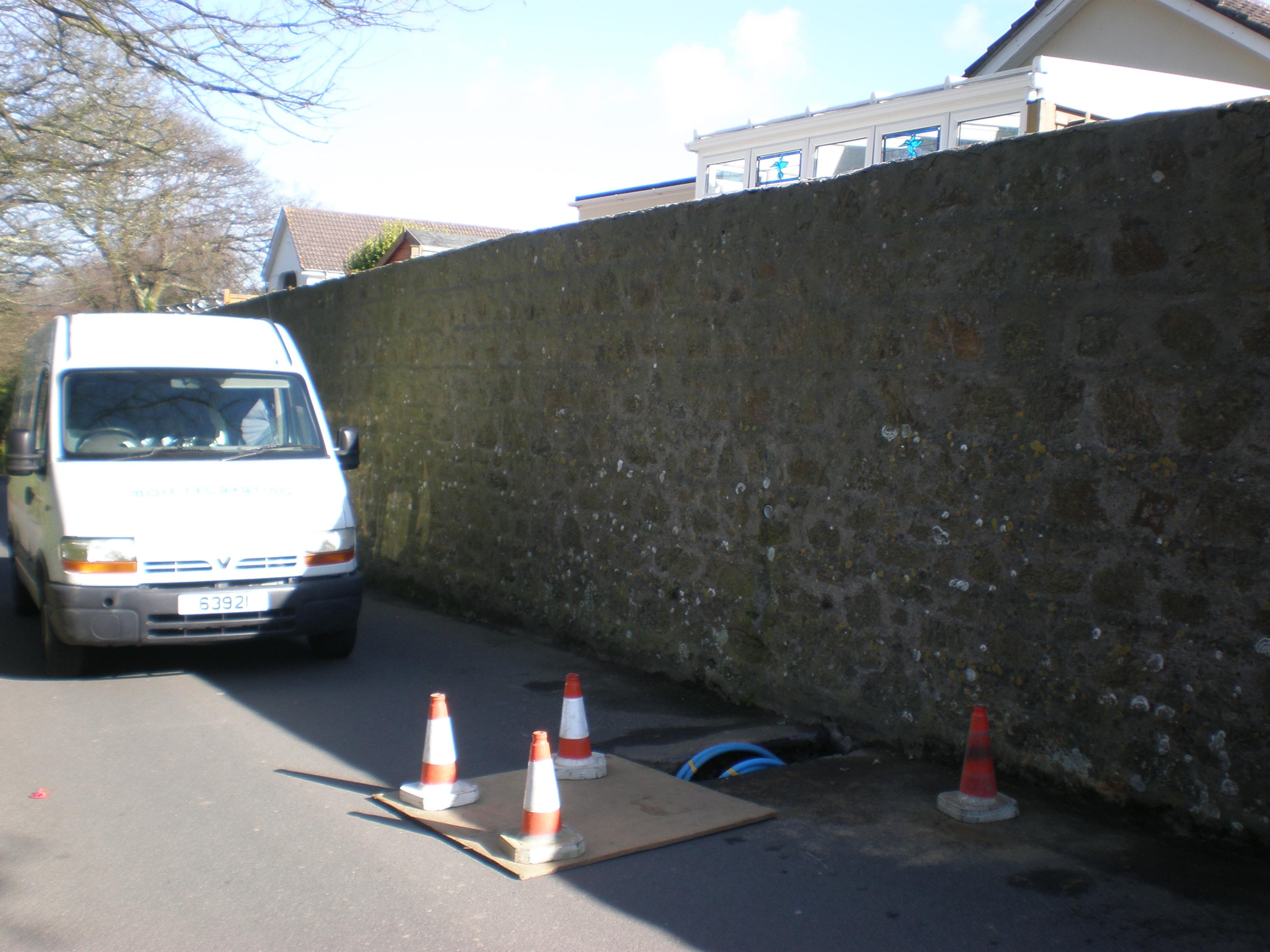 Guernsey Mole Excavating under a wall